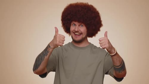Bearded Man Raises Thumbs Up Agrees or Gives Positive Reply Recommends Advertisement Likes Good
