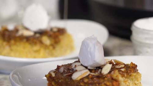 Close Up of Delicious Cake With Cream and Almonds