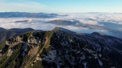 Aerial View of Mountainous Landscape with Forests Valley Full of Fog