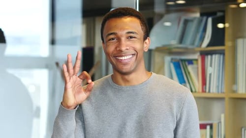 Smiling Man Giving Okay Hand Gesture