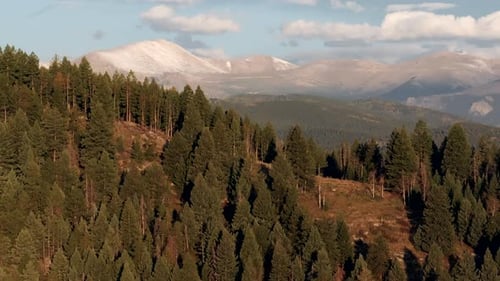 Cinematic aerial drone zoomed first snow on Denver Mount Blue Sky Evans 14er peak early autumn fall