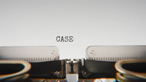 Old mechanical typewriter typing Case File in a close-up view.