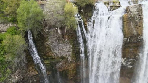 Majestic Waterfall Cascading Down Rocky Cliffside