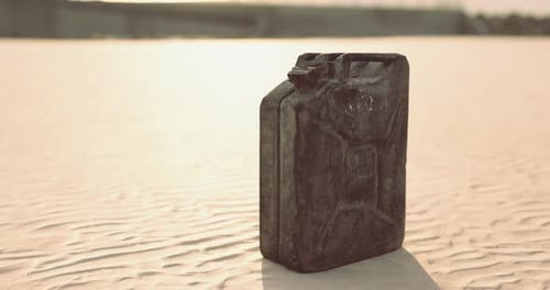 Old Jerrycan Standing in a Desolate Desert Landscape