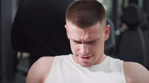 Fitness Fanatic Straining On Leg Press Machine