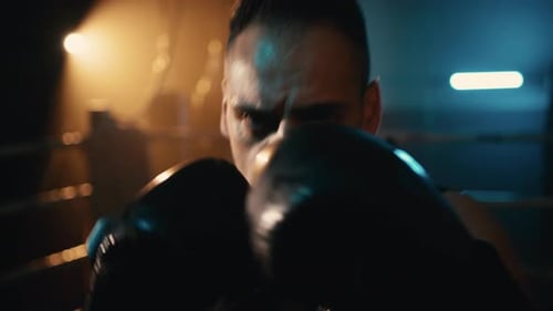Intense Boxer Training Hard in the Ring
