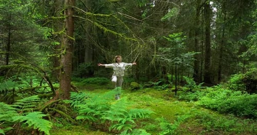 Female Person Relaxing Outdoors in Peaceful Green Landscape In Harmony