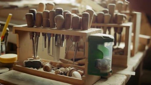 Unknown Woodworker Taking Tool in Carpentry Workshop. Closeup Unrecognized Master Choosing Tool