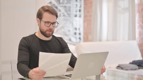 Man Working from Home Celebrates Success