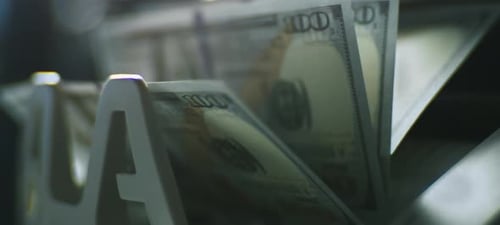 Counting dollars in bank