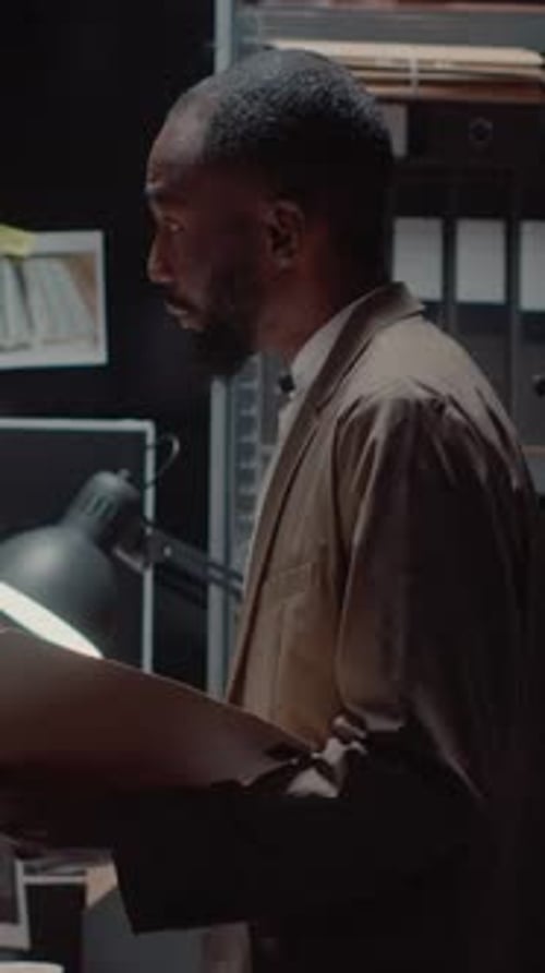 Vertical Video Detectives Colleagues Examining Criminal Files in Office