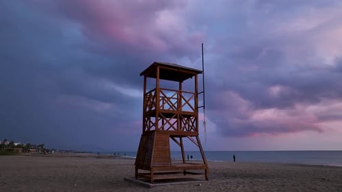 Rescue Tower on the Seashore Aerial View and a Very Beautiful Sunset