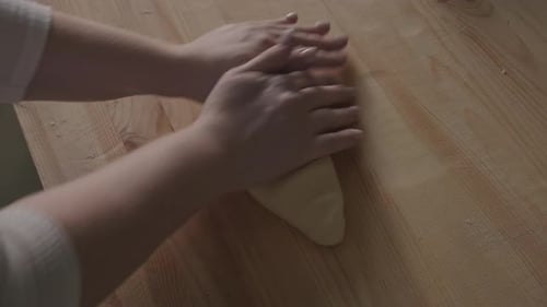Woman Hands Close Up Kneading Dough on Floured Table Preparing Home Made Sourdough Bread