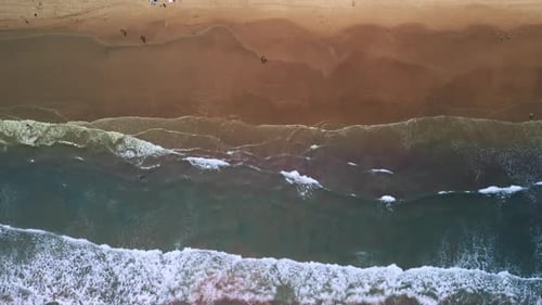 Drone Above Shot of Sand Beach on a Summer Day While Turquiose Sea Waves Breaking on Sandy Coastline