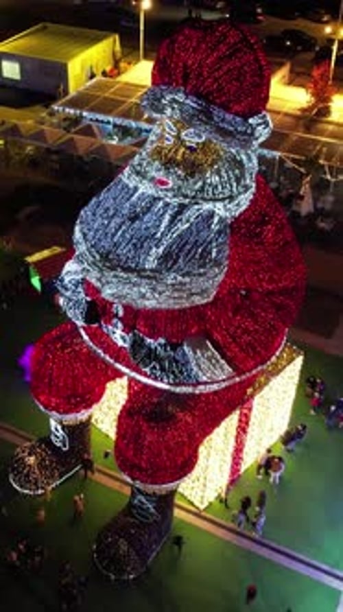 Vertical Video of Santa Claus in the City Decoration at Night