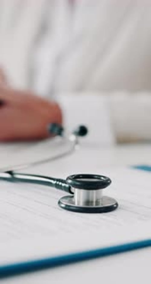 Stethoscope, clipboard and information with people at doctors office for medical records