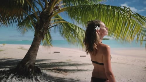 Tourist Woman Enjoying Tropical Paradise Beach with Palm Tree