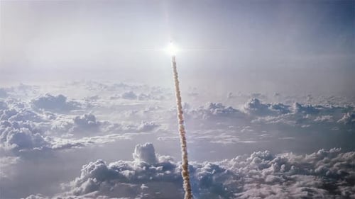 Powerful Rocket Launching Through Clouds Towards Space