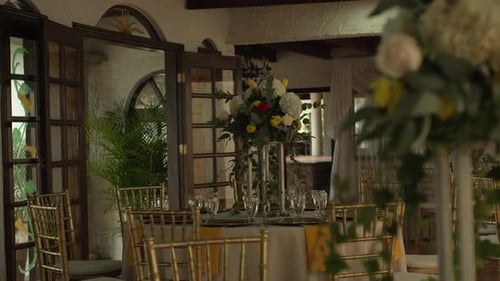 Hall with tables decorated for wedding reception with fresh flowers. Banquet table.