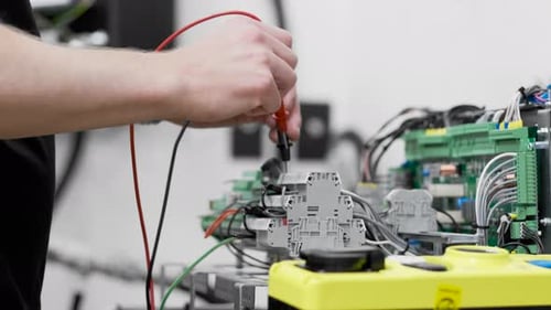 Electrician safely wiring circuitboard installation electric component motherboard system elevator e