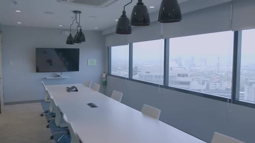 Slow Panning Shot Of A Stylish And Modern Meeting Room In A Corporate Office With Buildings Outside