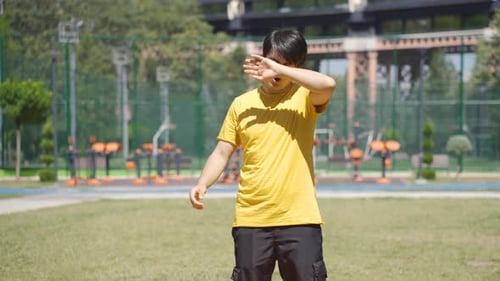 Determined and tired expression of young man ending sport.