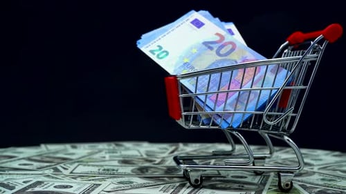 Euros in Shopping Cart on US Dollar Bills