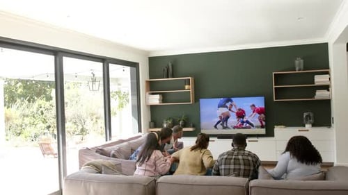 Friends Watch Sports Game and Celebrate Together