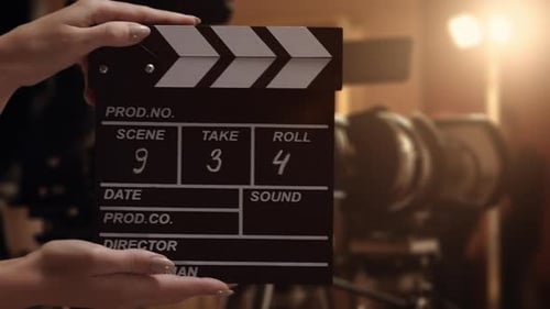 Human Hands are Using a Clapperboard on Set Beginning of Scene in Film or TV Television Production