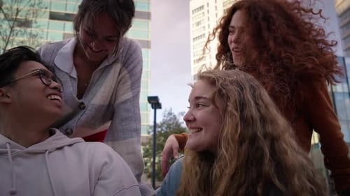 Friends Laughing Together in City Setting