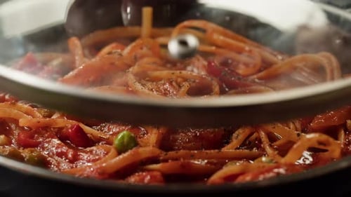 Steaming Spaghetti with Red Sauce Cooking in Pan