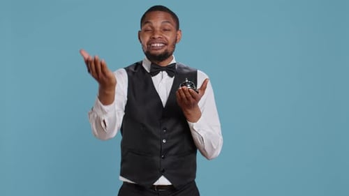 Man Rings Service Bell and Gestures to Camera