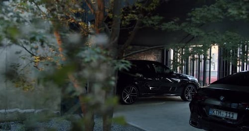 Luxury Car Parked in Modern Underground Garage at Dusk