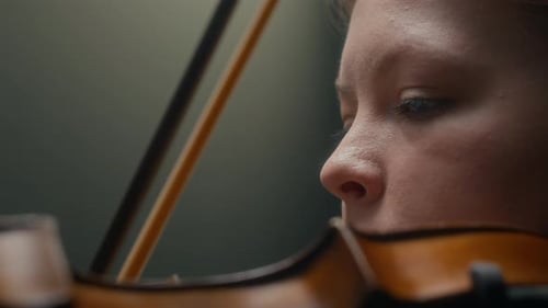 Woman Playing Violin Close Up