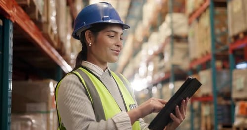 Warehouse Worker Using Tablet in Urban Workplace