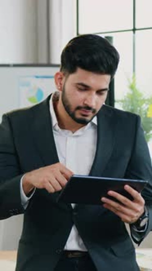 Likable Successful Positive Experienced 30Aged Bearded Office Manager in Formal Wear and Earrings in