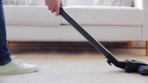 Vacuum Cleaner on Shag Carpet Cleaning in Home