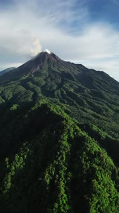 Aerial View of Active Volcano with Lush Green Forest in Indonesia