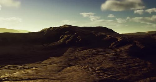 Vast Desert Landscape Bathed in Golden Sunlight During Dusk Hours
