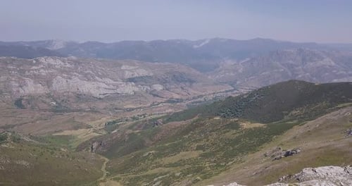 Aerial Flyover Mountain Ridge to Reveal the Valley Below
