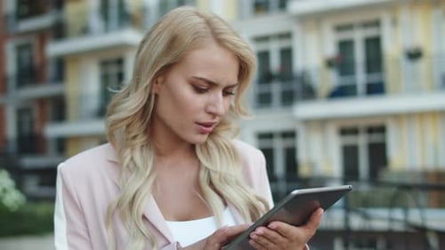Portrait Serious Businesswoman Walking In Suit At Street. Thoughtful Business Woman Using Tablet ...