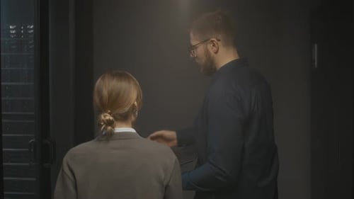 Young Couple of Data Center Technicians Entering Server Room for Inspection