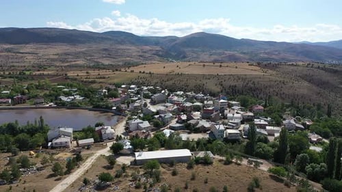 Aerial View Of Village Houses Between Mountains