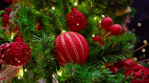 Close-up of a Christmas tree with red ornaments