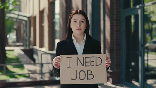 Sad Caucasian Businesswoman Holding Poster Cardboard with Need Job Jobless Message Crisis Text Job