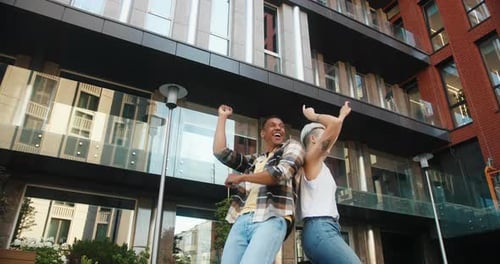 Friends Dance Together with Exuberant Joy