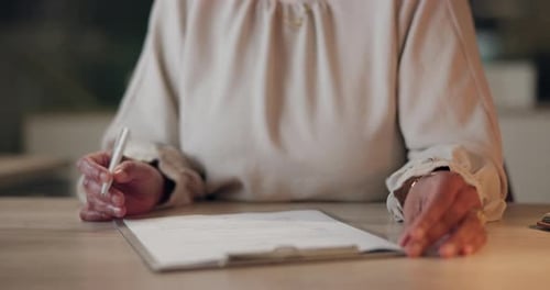 Woman Signing Legal Paperwork in Office Close Up
