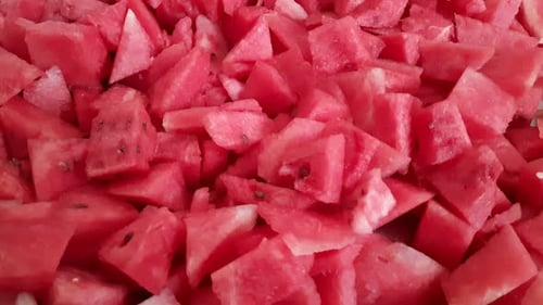 Cut watermelon and pieces, Appetizing Juicy Pulp of Watermelon. Triangular pieces of watermelon are