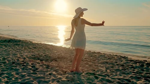 Happy Cheerful Girl Having Fun on Sandy Beach at Sunset Attractive Brunette Woman on Ocean Waves