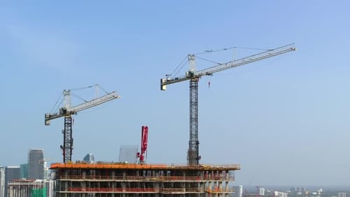 Construction Site of Developing Highrise Residence in American Urban Area Industrial Tower Lifting